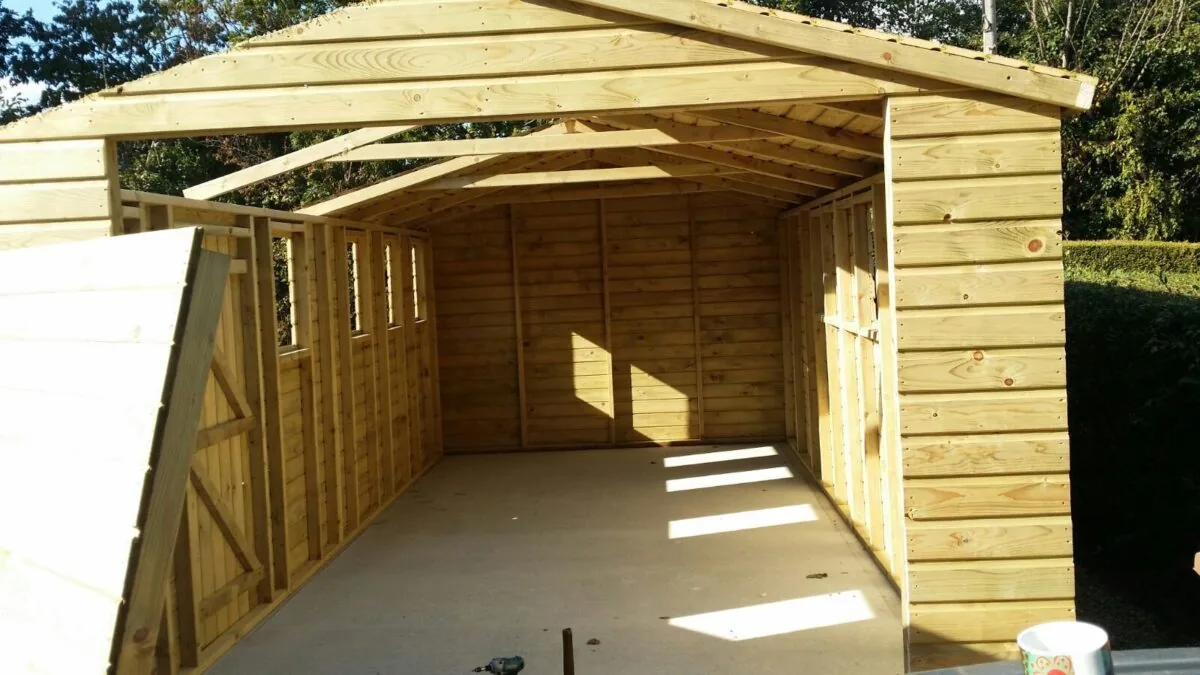 A timber Hampstead garage going up, its frame and cladding in place