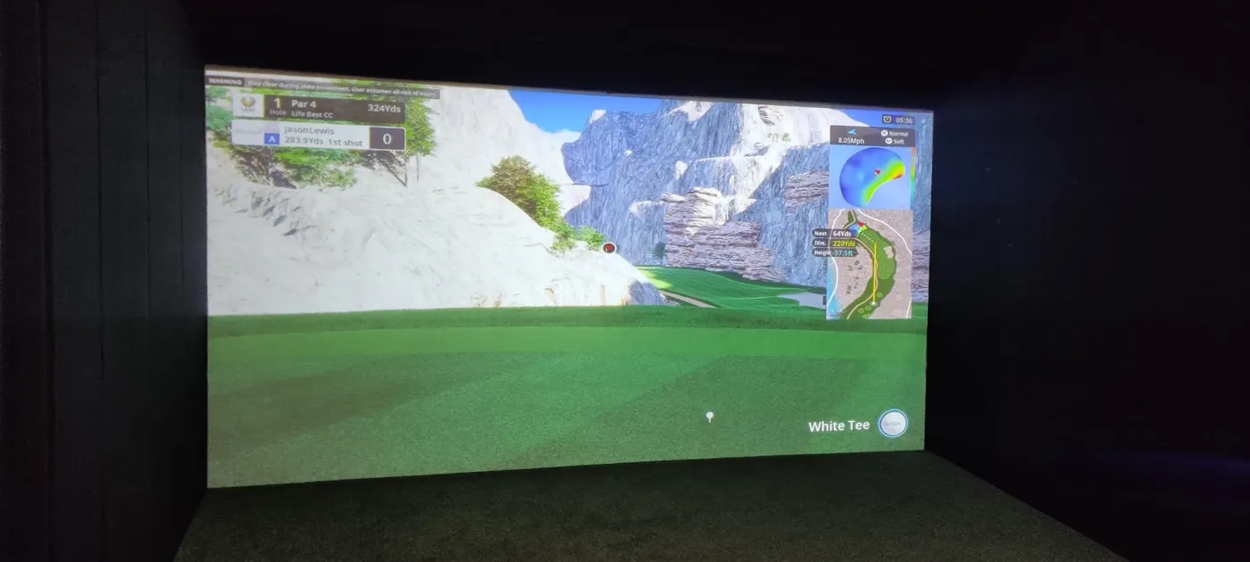 Golf simulator screen and hitting area inside the Cardiff garden building